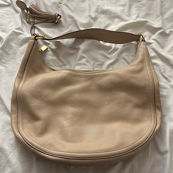 Tan Michael Kors Hobo shoulder bag.